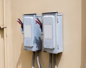 Professional Hot Shot Electric certified electrician upgrading breaker box – licensed Tulsa experts fix tripped breakers and install modern panels for safe home power.