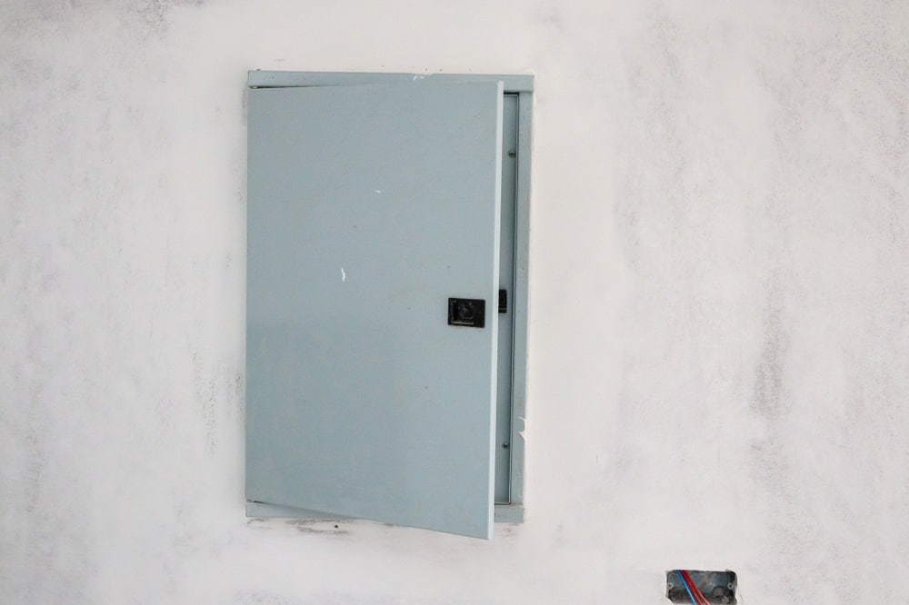 Professional Hot Shot Electric certified electrician upgrading breaker box – licensed Tulsa experts fix tripped breakers and install modern panels for safe home power.