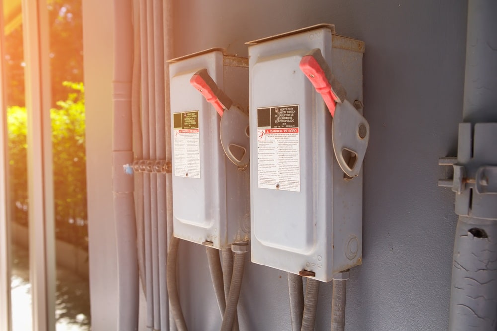 Professional Hot Shot Electric certified electrician upgrading breaker box – licensed Tulsa experts fix tripped breakers and install modern panels for safe home power.
