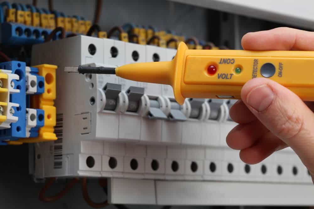 Professional Hot Shot Electric certified electrician upgrading breaker box – licensed Tulsa experts fix tripped breakers and install modern panels for safe home power.