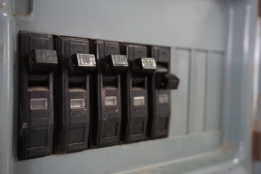 Professional Hot Shot Electric certified electrician upgrading breaker box – licensed Tulsa experts fix tripped breakers and install modern panels for safe home power.