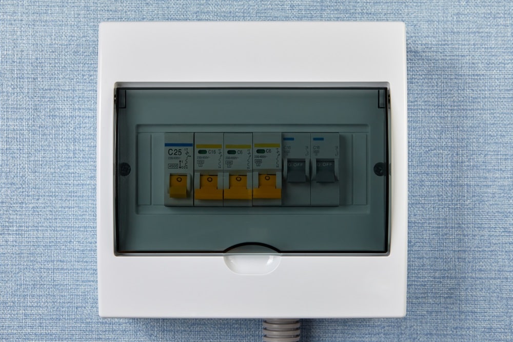 Professional Hot Shot Electric certified electrician upgrading breaker box – licensed Tulsa experts fix tripped breakers and install modern panels for safe home power.