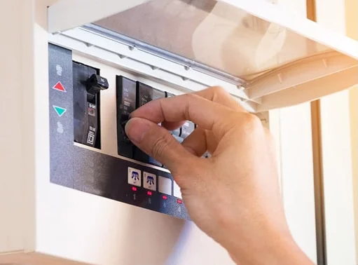 Professional Hot Shot Electric certified electrician upgrading breaker box – licensed Tulsa experts fix tripped breakers and install modern panels for safe home power.