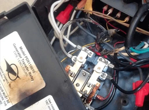 Damaged outdated breaker box with tripped breakers – professional Hot Shot Electric licensed experts diagnose and repair unsafe panels for home safety in Tulsa OK.