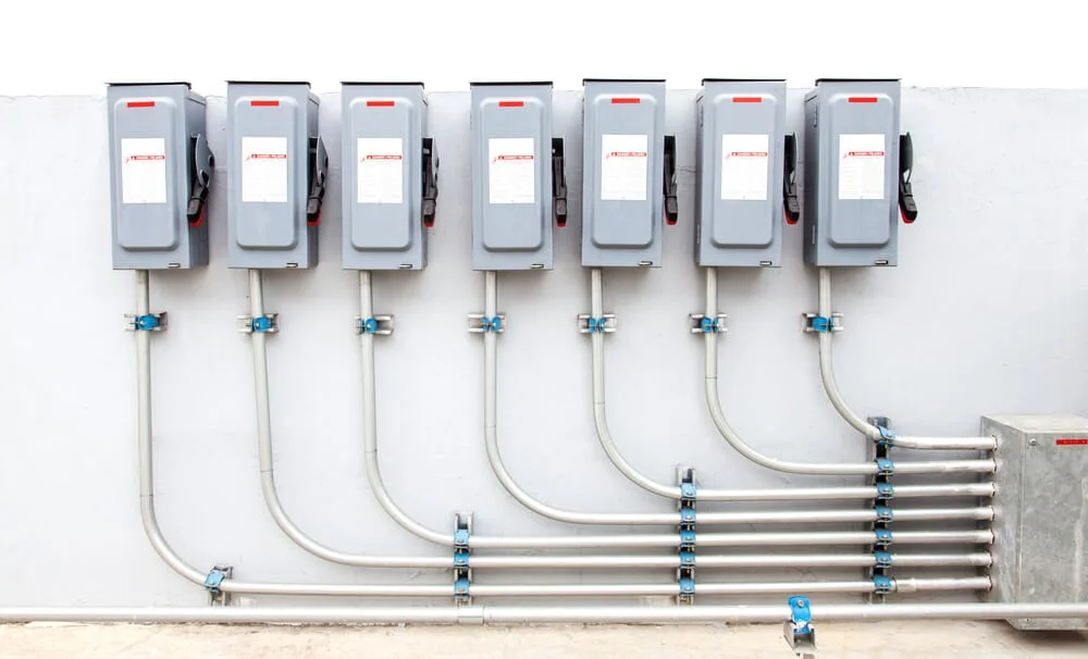 Professional Hot Shot Electric certified electrician upgrading breaker box – licensed Tulsa experts fix tripped breakers and install modern panels for safe home power.