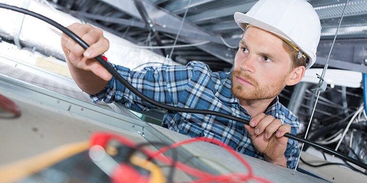Licensed Hot Shot Electric professionals repairing hazardous aluminum wiring – certified Tulsa experts safely upgrade connections to prevent fire risks.