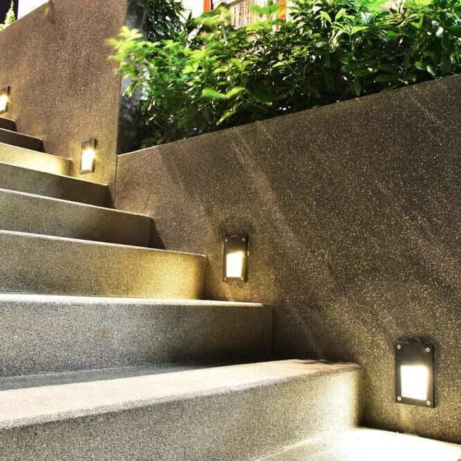 Professional Hot Shot Electric certified experts install landscape step lighting on outdoor staircase – licensed Tulsa electricians add safe, energy-efficient LED path lights for enhanced safety and beauty in Oklahoma homes.