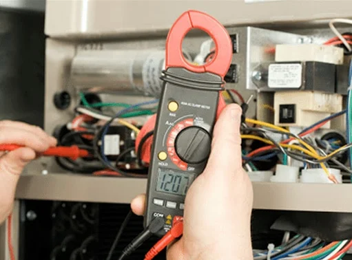 Professional Hot Shot Electric certified electrician upgrading breaker box – licensed Tulsa experts fix tripped breakers and install modern panels for safe home power.